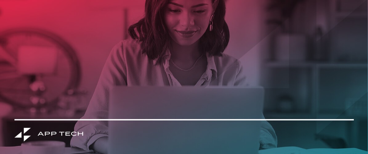 a woman sitting in front of a laptop with app tech written on the bottom