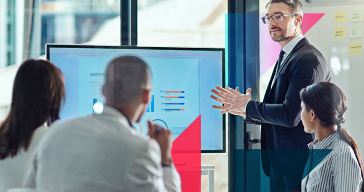 a man is giving a presentation to a group of people