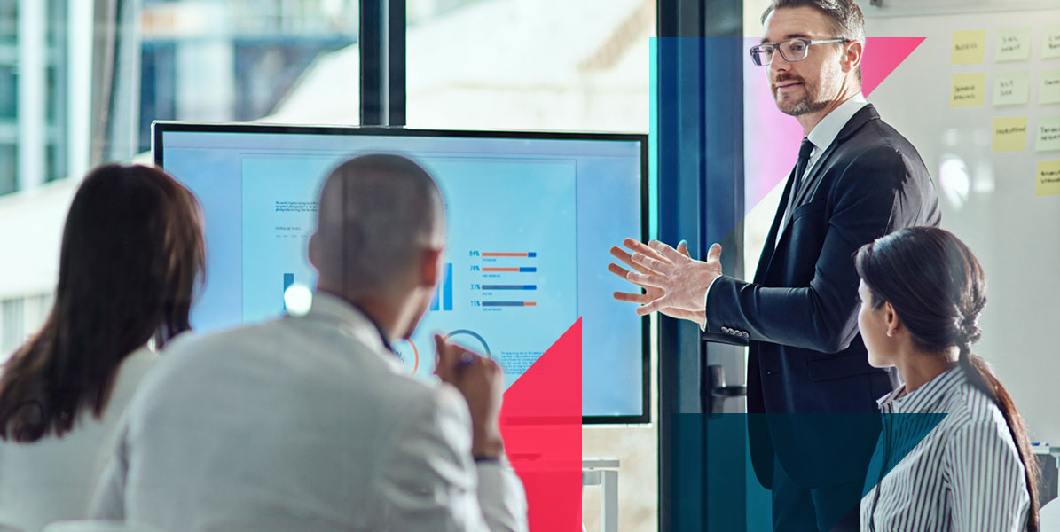 a man is giving a presentation to a group of people